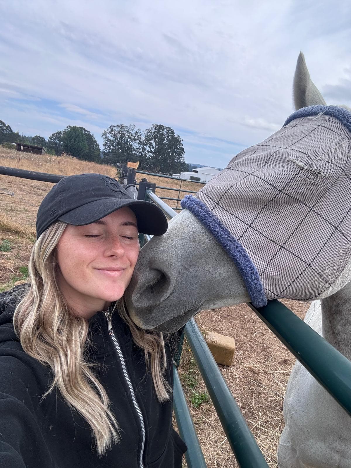 Brandi holding freshly harvested beets in the garden